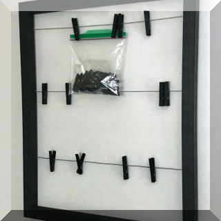 D69. Framed note keeper with clothespins. - $14